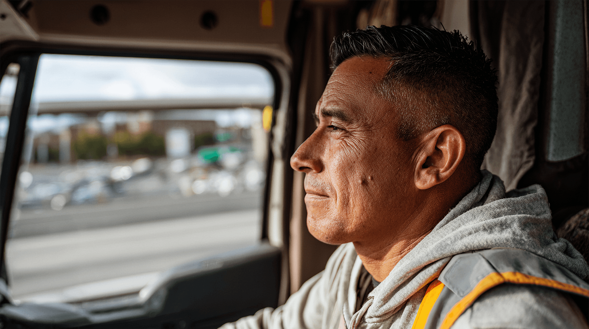 Ready-mix truck driver sitting in cab