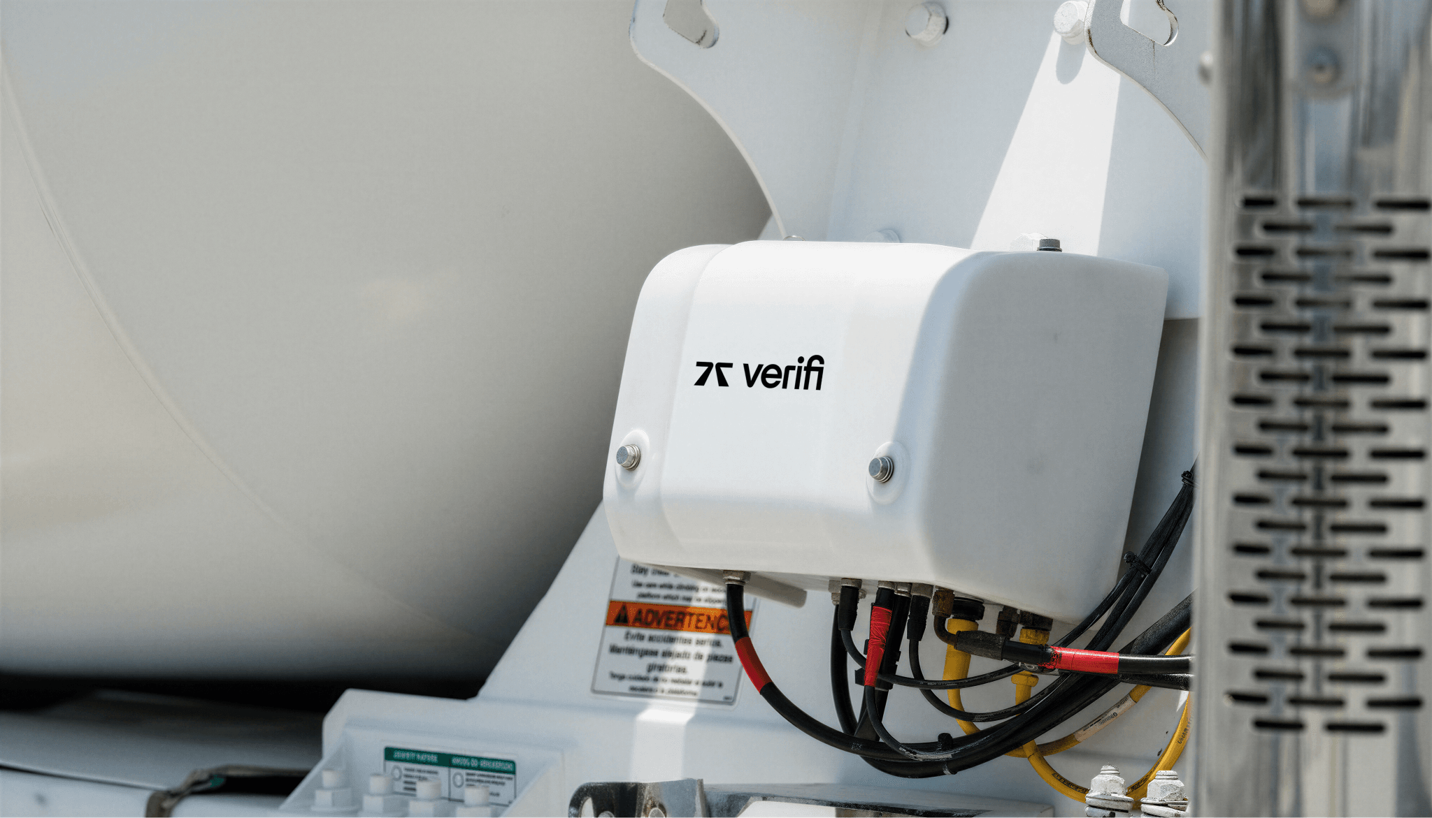 Verifi equipment appearing on a concrete truck, including the wiring and the Verifi logo